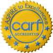 Gold circular badge with CARF accredited  Aspire to excellence on it